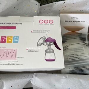 Manual Breast Pump with Purple Accents with nipple covers and breast milk bag’s